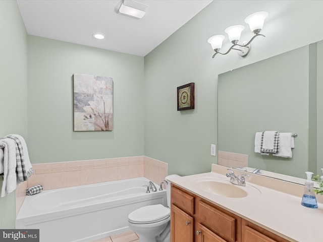 bathroom featuring tile patterned flooring, vanity, toilet, and a tub to relax in