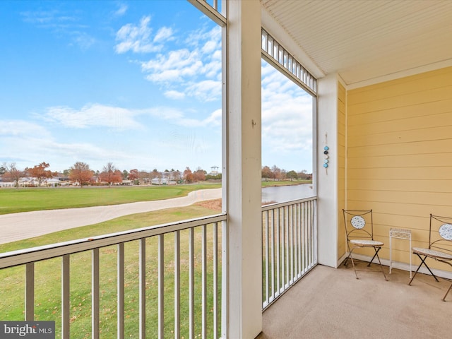 balcony featuring a water view