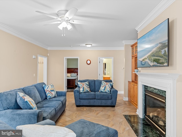 living room featuring ceiling fan, ornamental molding, and a premium fireplace