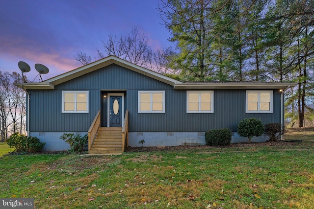 view of front of property with a yard