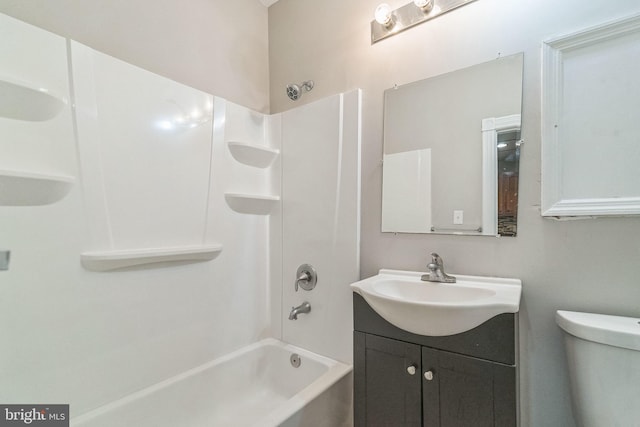 full bathroom featuring shower / bathing tub combination, vanity, and toilet