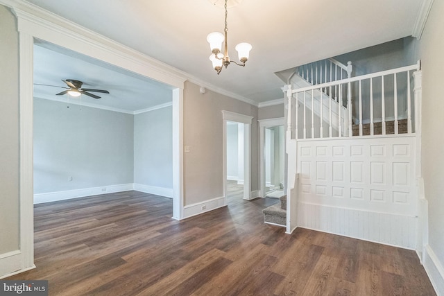 spare room featuring dark hardwood / wood-style floors, crown molding, and ceiling fan with notable chandelier