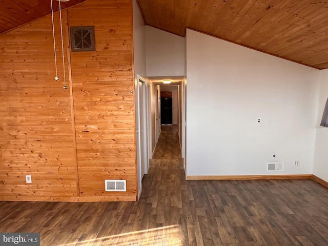 interior space with wooden walls, high vaulted ceiling, wooden ceiling, and dark hardwood / wood-style floors