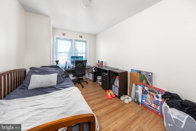 bedroom with wood-type flooring