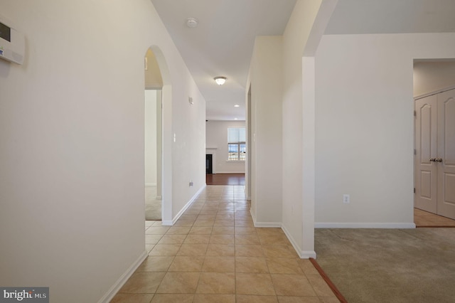 hallway with light tile patterned floors