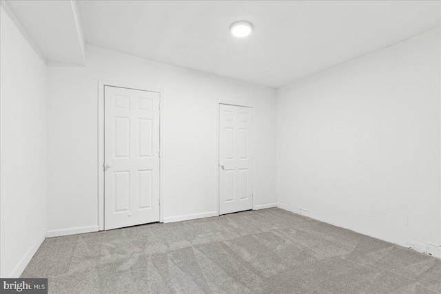 unfurnished bedroom with light carpet