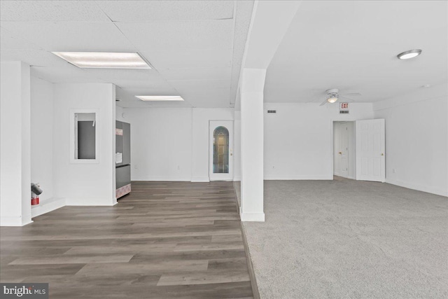 unfurnished living room with ceiling fan and dark hardwood / wood-style floors