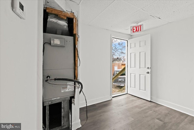 foyer entrance with a drop ceiling and hardwood / wood-style flooring