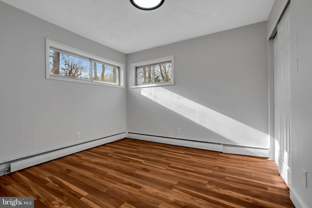 spare room with wood-type flooring