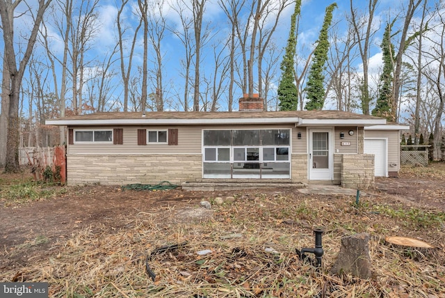 single story home featuring a garage