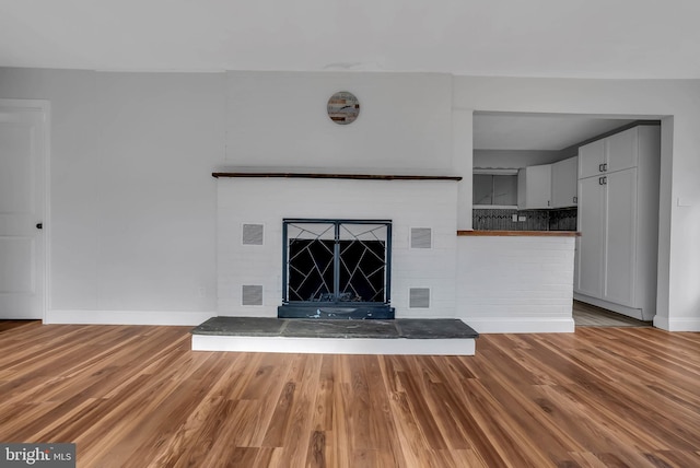 unfurnished living room featuring light wood-type flooring