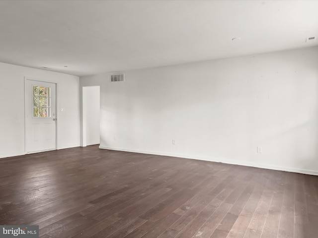 empty room featuring dark hardwood / wood-style floors