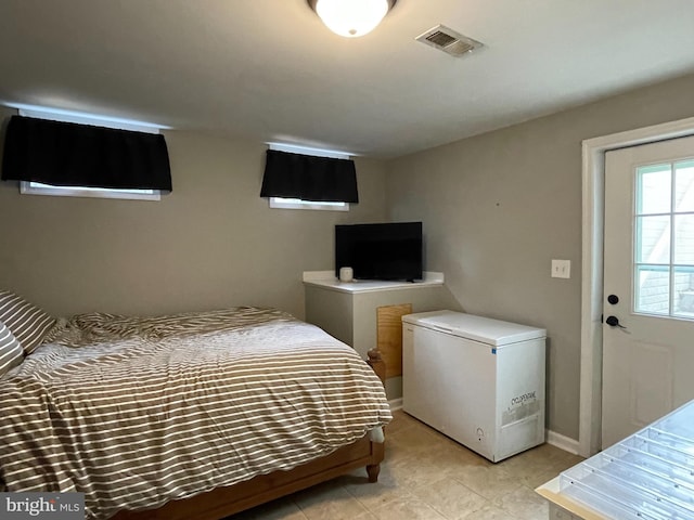 bedroom with refrigerator