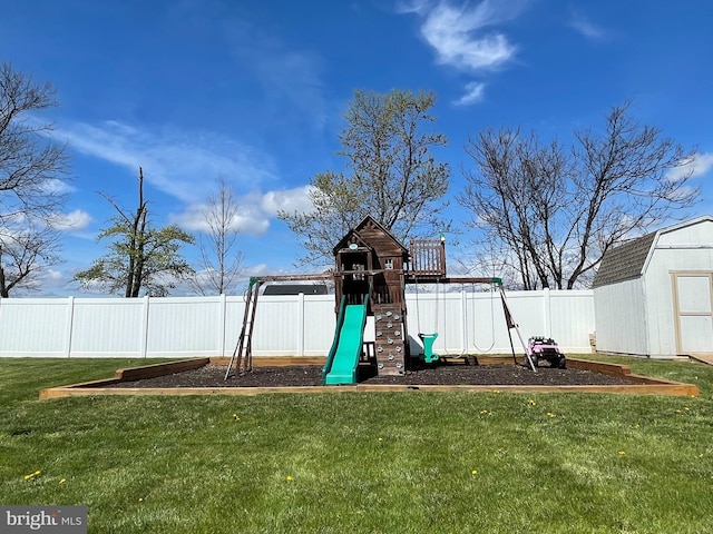 view of jungle gym featuring a lawn