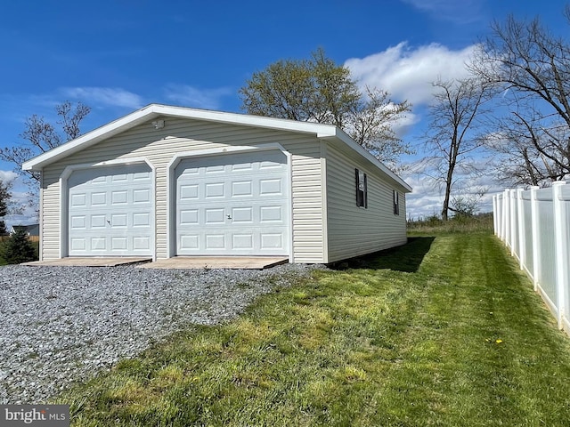 garage featuring a yard