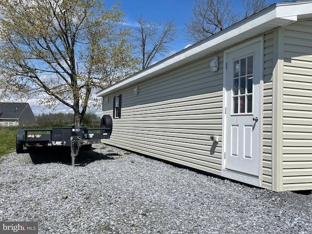 view of side of home featuring a wooden deck