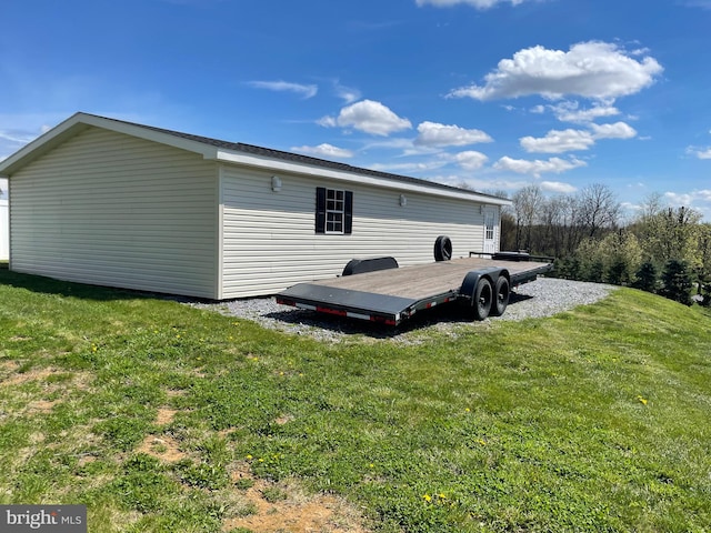 exterior space with a wooden deck and a yard