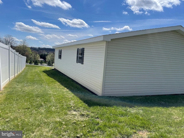 view of home's exterior with a lawn