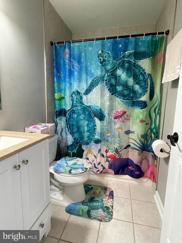 bathroom with curtained shower, tile patterned flooring, vanity, and toilet