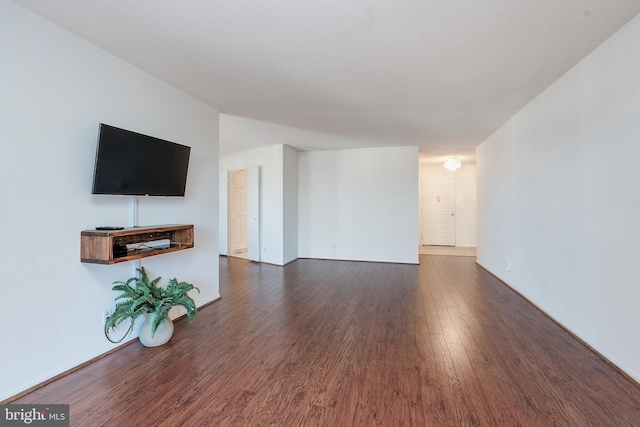 8370 Greensboro Dr Unit 414, Mclean, VA 22102 - unfurnished living room featuring wood finished floors and baseboards