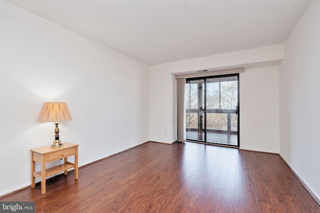 8370 Greensboro Dr Unit 414, Mclean, VA 22102 - unfurnished room with dark wood-style floors and baseboards