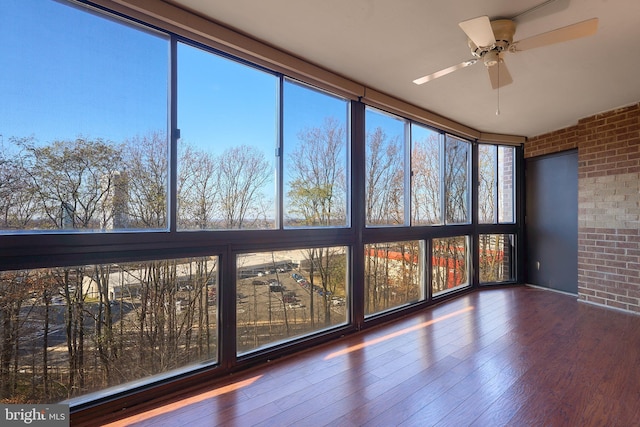 8370 Greensboro Dr Unit 414, Mclean, VA 22102 - unfurnished sunroom with brick wall, ceiling fan, and wood finished floors