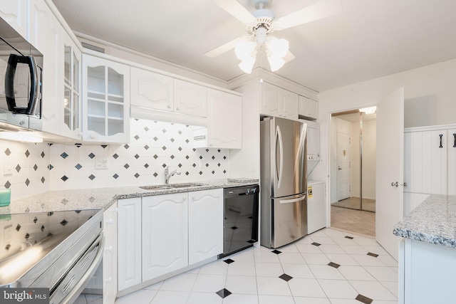 8370 Greensboro Dr Unit 414, Mclean, VA 22102 - kitchen with stainless steel appliances, a sink, ceiling fan, washer / clothes dryer, and glass insert cabinets