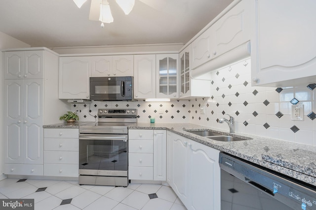8370 Greensboro Dr Unit 414, Mclean, VA 22102 - kitchen with black appliances, a sink, light stone countertops, and white cabinets