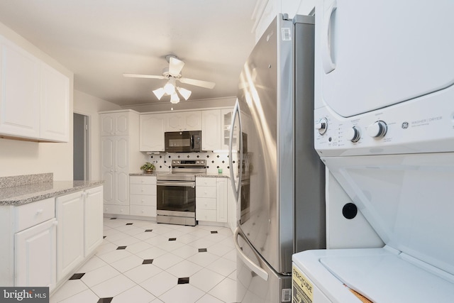 8370 Greensboro Dr Unit 414, Mclean, VA 22102 - kitchen with appliances with stainless steel finishes, estacked washer and dryer, white cabinetry, and a ceiling fan