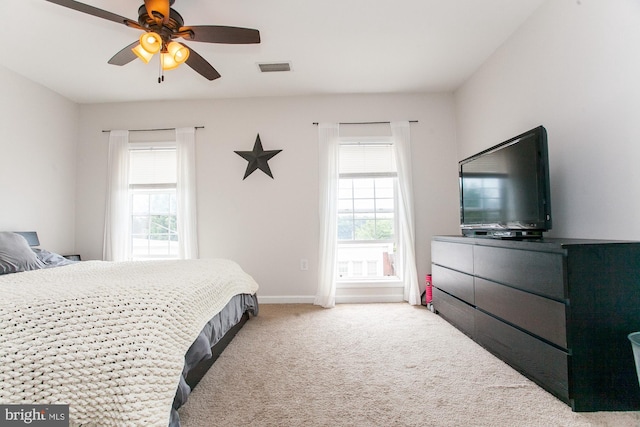 bedroom featuring ceiling fan and carpet floors