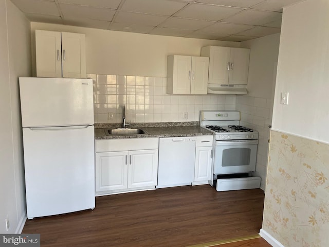 kitchen with white cabinets, white appliances, dark hardwood / wood-style floors, and sink