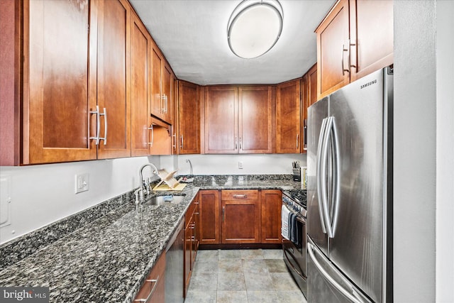 1830 Columbia Pike Unit 410, Arlington, VA 22204 - kitchen featuring stainless steel appliances, dark stone counters, and sink