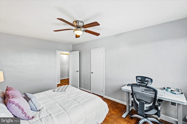 1830 Columbia Pike Unit 410, Arlington, VA 22204 - bedroom with a desk, baseboards, a ceiling fan, and wood finished floors