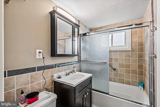 1830 Columbia Pike Unit 410, Arlington, VA 22204 - full bath featuring vanity, bath / shower combo with glass door, toilet, and tile walls