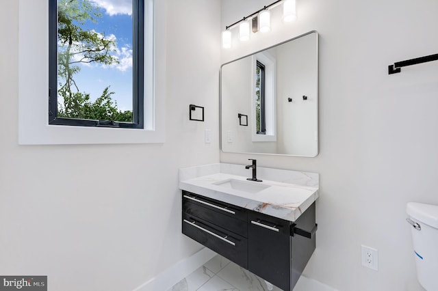 bathroom with vanity and toilet