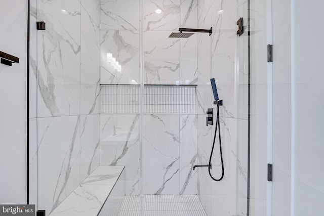 details with a shower with shower door