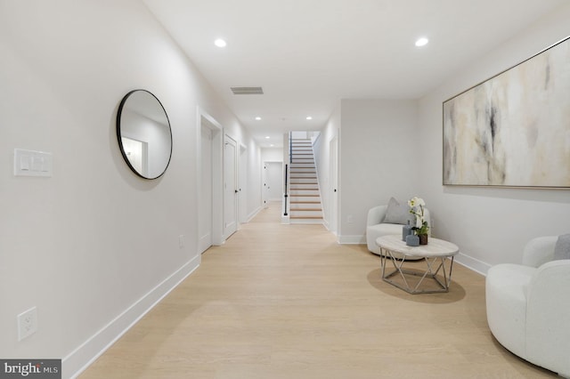 hall with light hardwood / wood-style floors