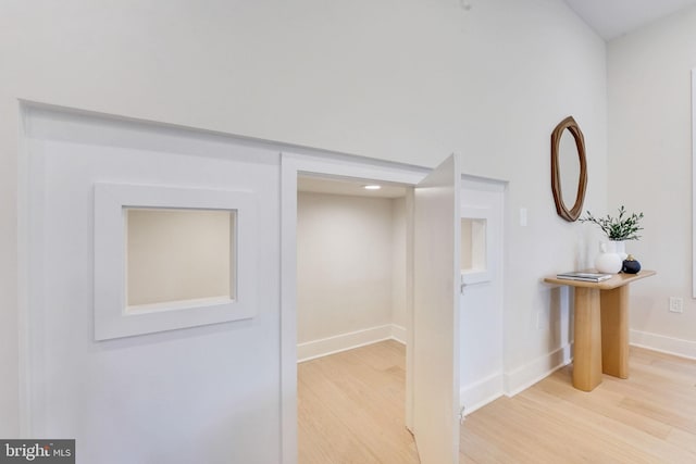 hallway with light wood-type flooring