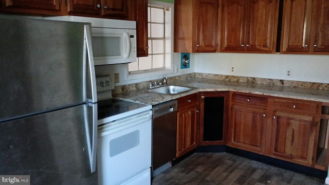 7105 Wainwright Ave, Parsonsburg, MD 21849 - kitchen with white appliances, a sink, dark wood-style floors, and brown cabinetry
