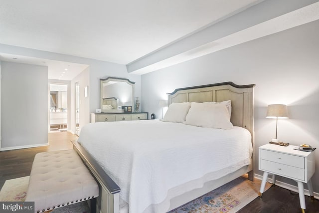 bedroom featuring dark hardwood / wood-style flooring