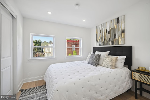 bedroom featuring hardwood / wood-style flooring and a closet