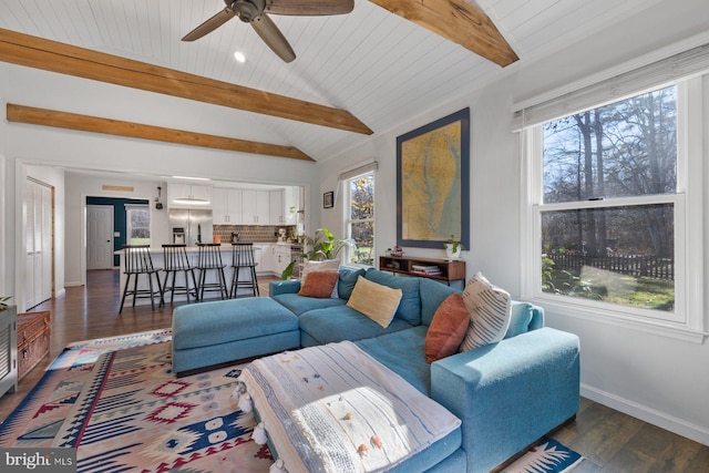 living room featuring vaulted ceiling with beams, ceiling fan, dark wood-type flooring, and wood ceiling