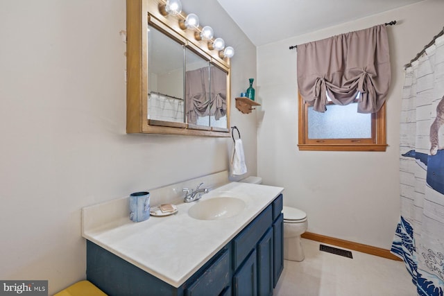 bathroom with vanity and toilet