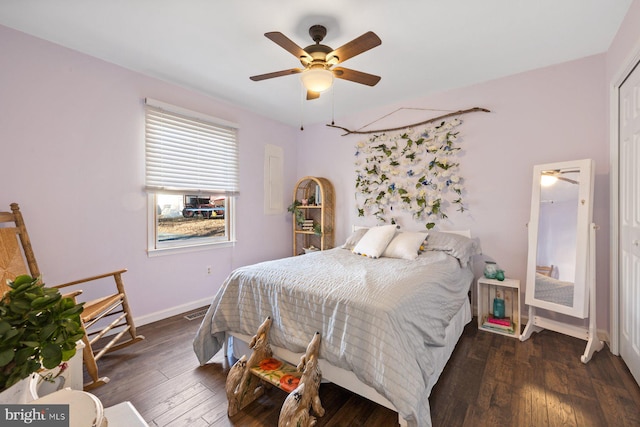 bedroom with ceiling fan and dark wood-type flooring