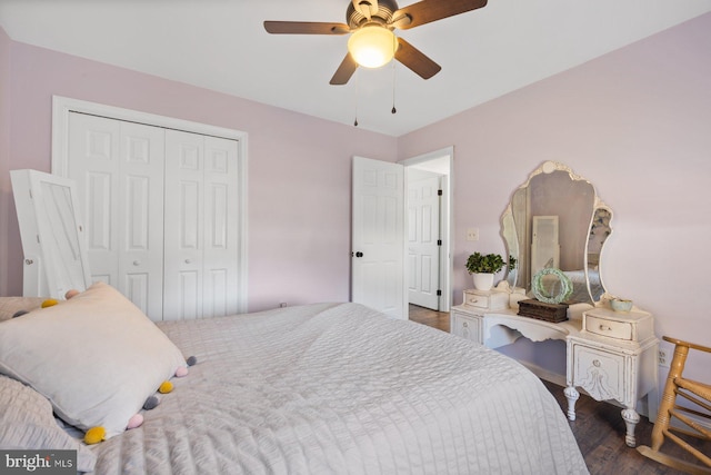 bedroom featuring ceiling fan, a closet, and dark wood-type flooring