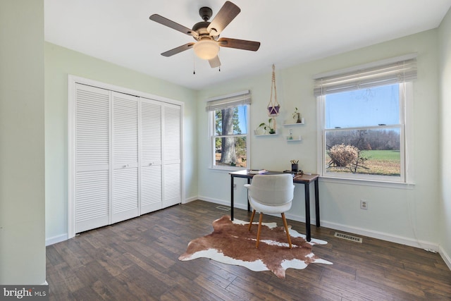 office area with ceiling fan and dark wood-type flooring