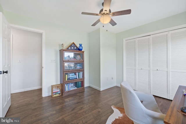 office area with ceiling fan and dark hardwood / wood-style flooring