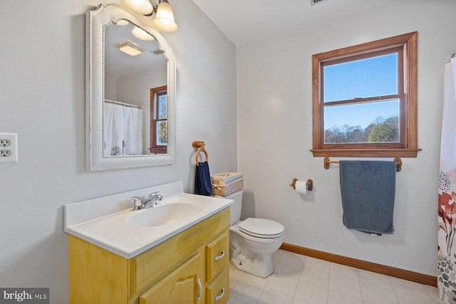 bathroom with tile patterned floors, vanity, and toilet