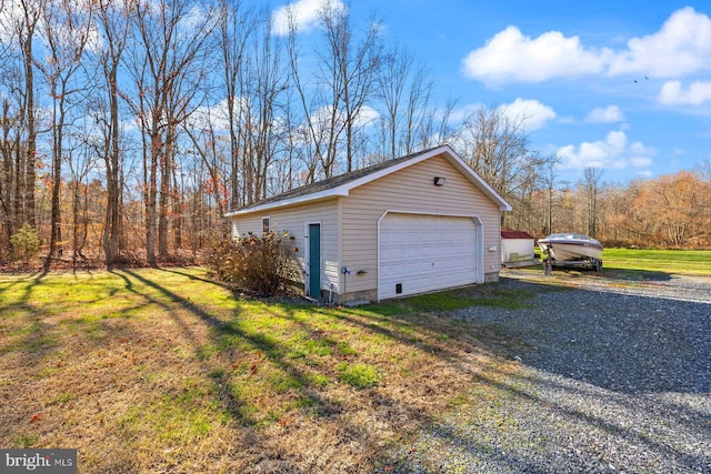 garage with a yard