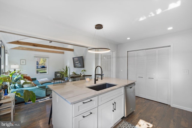 kitchen with a kitchen island with sink, sink, pendant lighting, dishwasher, and white cabinetry